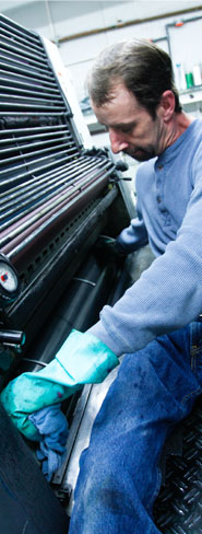 man working on press