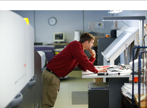 man working prepress on a digital press